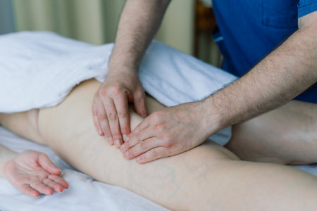 Woman receiving cupping on back at spa for joint pain reliefの写真素材