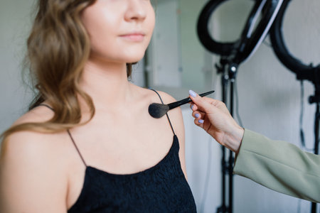 Make-up artist work in her studio with modelの写真素材