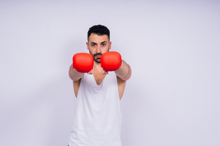 A man boxing with a red gloves on his hands. Professional fighter, boxer.