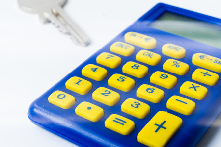 The calculator and a home key macro closeup, white backgroundの写真素材
