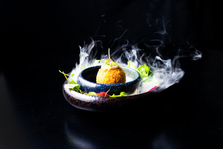 Closeup of some croquettes in bed of lettuce served as tapasの写真素材