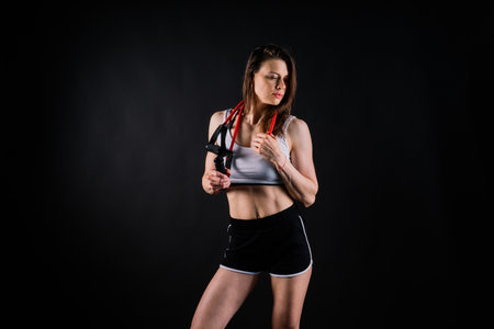 Athletic female performs exercises using resistance band. Strength and motivationの写真素材