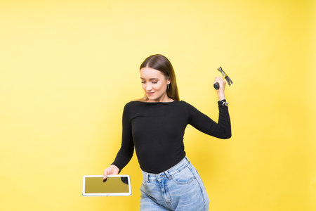 Attractive blond hair woman wearing business suit holding a hammerの写真素材