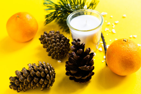 Christmas background with a fir tree branches and tangerines. Merry Christmas and Happy New Yearの写真素材