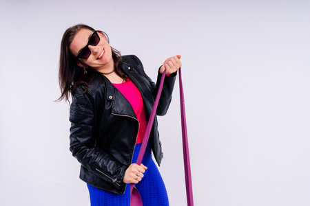 Full length photo of young smiling woman wearing sportswearの写真素材