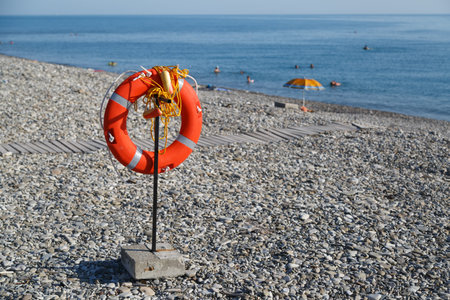 Lifebuoy hangs on the beach for the safety of people on the seaの写真素材