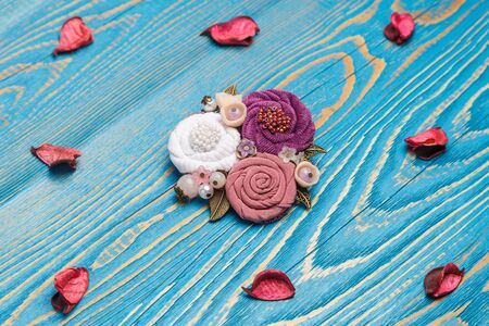 Brooch handmade isolated on white background, pink and lilac flowersの写真素材