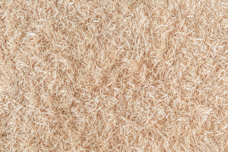 Surface of a beige carpet made of ropes as a backgroundの写真素材