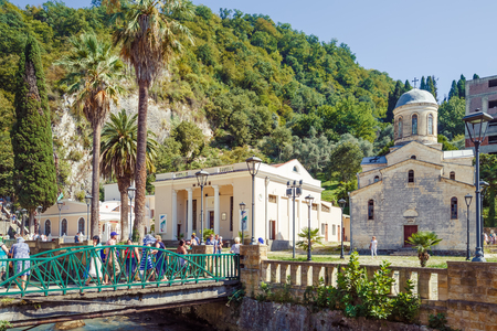 NEW ATHOS, ABKHAZIA, GEORGIA, 19 SEPTEMBER 2017: View of the bridge across the river and the Saint Simon the Canaanite Churchのeditorial素材