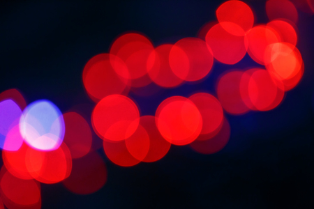 Red abstraction of bokeh on the black backgroundの写真素材