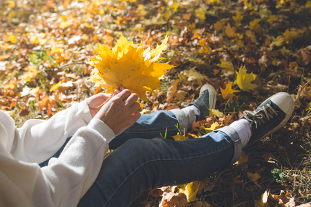 Girl sits in her handsの写真素材