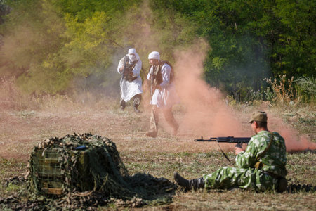 SAMBEK, ROSTOV REGION, RUSSIA, AUGUST 19, 2018: Reconstruction of Afghan war. Mujahideen attack the...