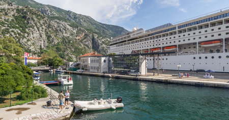 MONTENEGRO, KOTOR, August 06, 2014: Panorama overlooking cruise ship with tourists