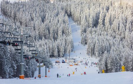 BUKOVEL, UKRAINE, 08 JANUARY, 2013: Beginners ski trail and outdoor chair liftのeditorial素材