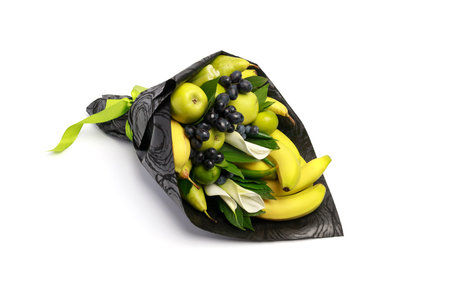 Unusual edible bouquet of bananas, pears, apples isolated on whiteの写真素材