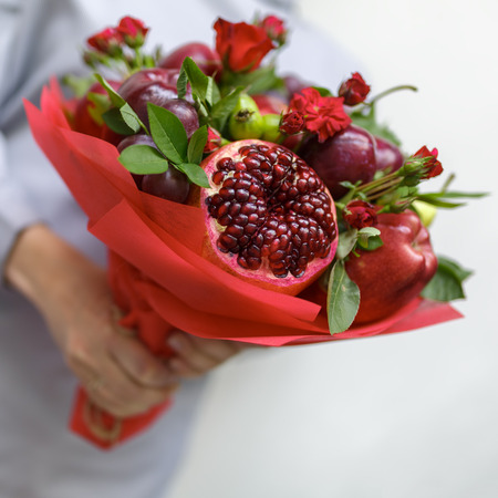 Bouquet of pomegranate, apples, grapes, plumsの写真素材
