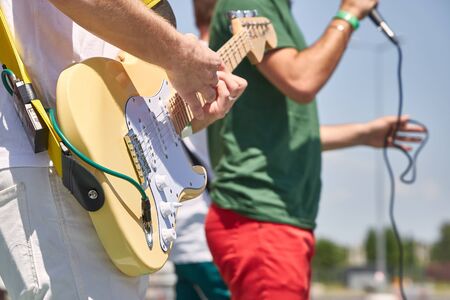 Young rock band performs their songsの写真素材