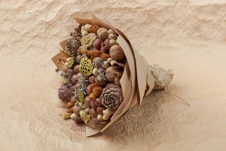 Unique bouquet of different types of nuts as an original giftの写真素材