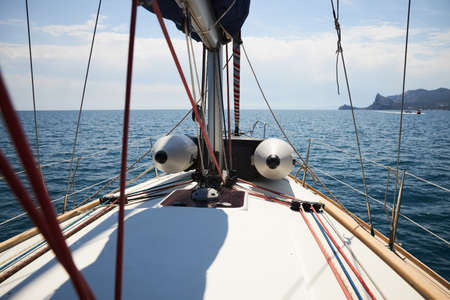 Sailing yacht moves along the coast of the Black Seaの写真素材