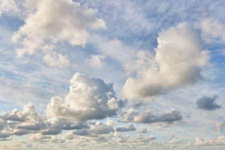 Beautiful fluffy clouds against the background of the blue sky in the afternoonの写真素材
