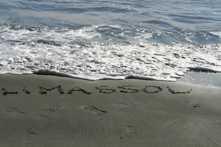 The word Limassol written on the sandの写真素材
