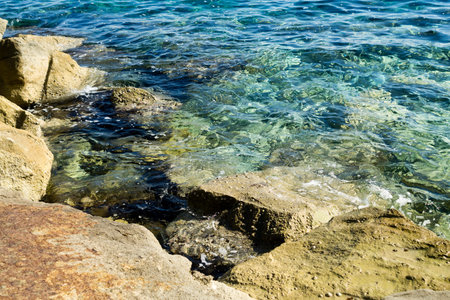 Yellow rocks and crystal clear transparent turquoise sea