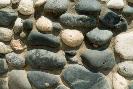 Texture of stone pavement from natural beach pebblesの写真素材