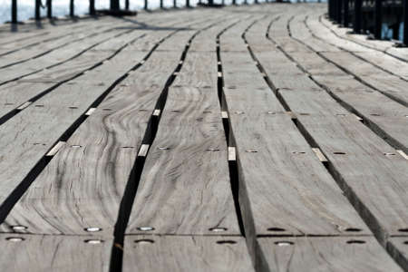 Close-up of wooden plank boardwalk on footbridgeの写真素材