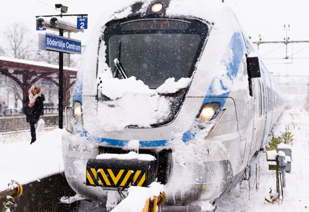 Stockholm, Sweden - November 9, 2016: Snowy local train has arrived at its final destination on a winter dayのeditorial素材