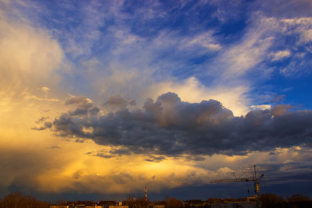 Large clouds over the city in the evening , photographyの写真素材