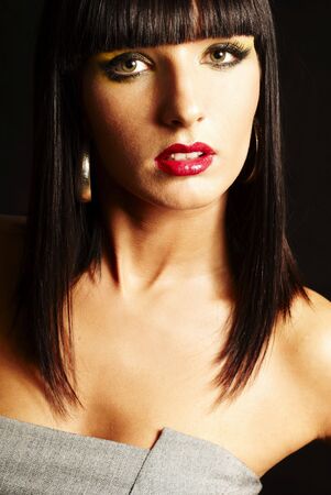 sensual brunette woman on dark background - close upの写真素材