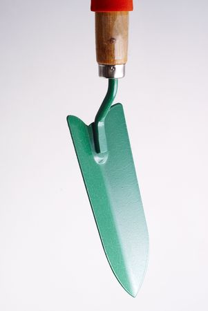 green garden shovel on a white background close upの写真素材