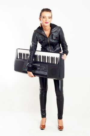 punk rock fashion girl holding a piano keyboardの写真素材