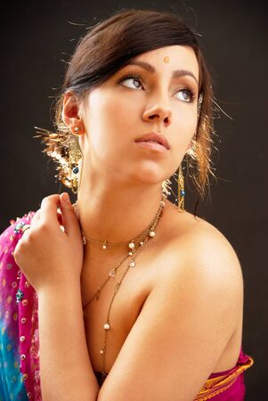 Beautiful indian brunette woman portrait with traditional costume の写真素材