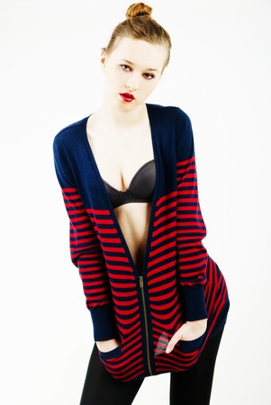 sexy girl posing in an unzipped cardigan and braの写真素材