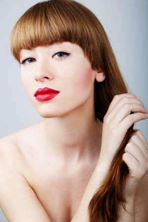 elegant and sexy woman touching her hairの写真素材