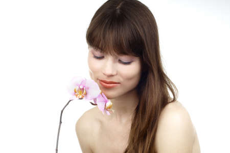 woman with an orchidの写真素材