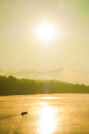 People were floating in the morning  There is fog cover mountainsの写真素材