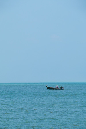 A boat floating in the oceanの写真素材