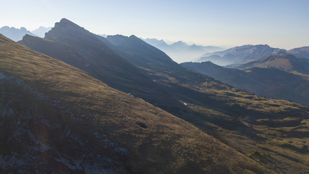 View of many mountain ranges lying one behind the otherの写真素材