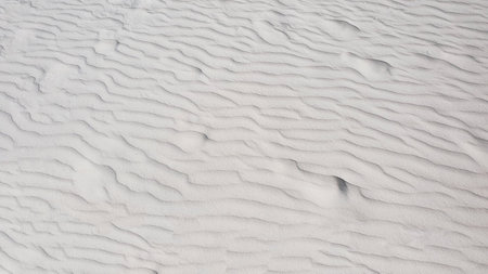 White sand dune texture. Abstract natural background. Close up.