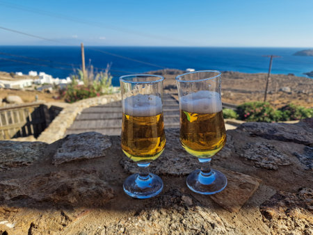 Two glasses of wine on the rocks, Santorini, Greeceの写真素材