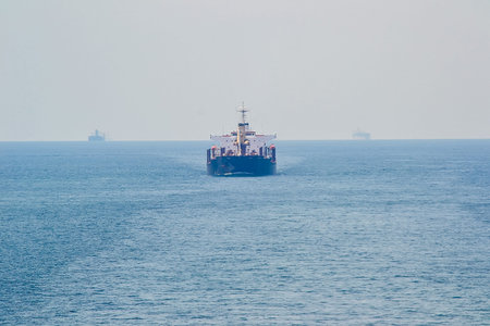 A large ship is sailing in the ocean