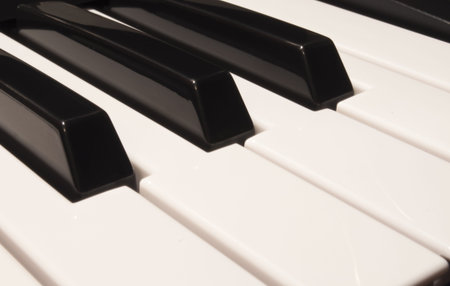 A close-up shot of a grand piano keyboard