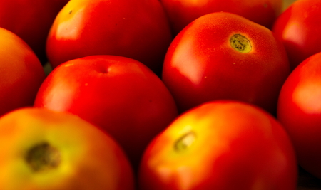 Fresh tomatoes on display at a nearby market.の写真素材