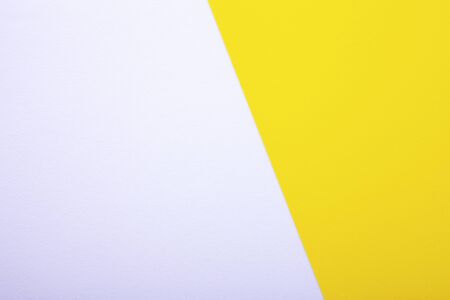 White and yellow paper texture as background with space for textの写真素材