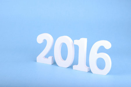 number 2016, as the new year, over a blue background