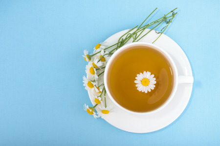 Cup of tea and chamomilesの写真素材