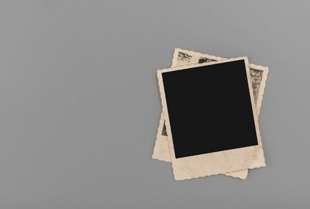 Blank vintage photos on grey backgroundの写真素材