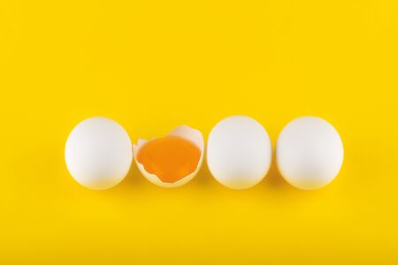 eggs on yellow background top viewの写真素材
